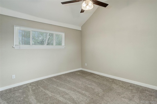 carpeted spare room with ceiling fan and lofted ceiling