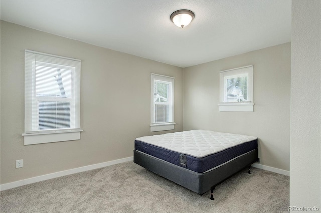 bedroom with light carpet