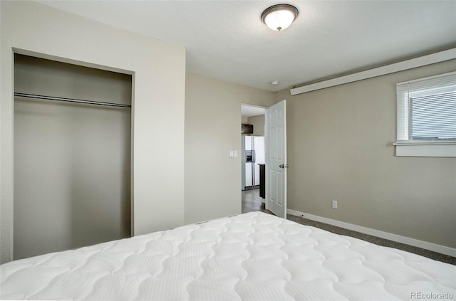 unfurnished bedroom with a closet and carpet