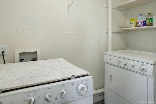 clothes washing area featuring washer and clothes dryer and hookup for a washing machine