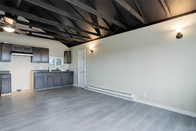 unfurnished living room featuring wood-type flooring, lofted ceiling with beams, a baseboard radiator, and ceiling fan