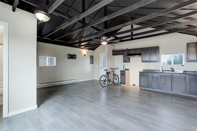 interior space featuring a baseboard radiator, ceiling fan, and a wall mounted air conditioner