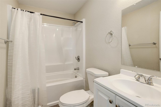 full bathroom featuring shower / bath combo, vanity, and toilet