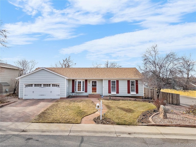 ranch-style home with concrete driveway, an attached garage, fence, and a front yard