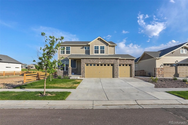 view of front facade featuring a front yard and a garage