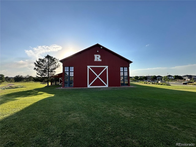 view of outdoor structure featuring a yard