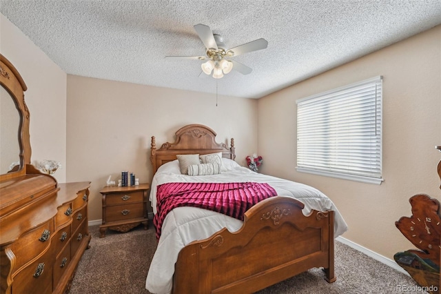 carpeted bedroom featuring ceiling fan and a textured ceiling