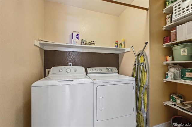 washroom with washer and dryer