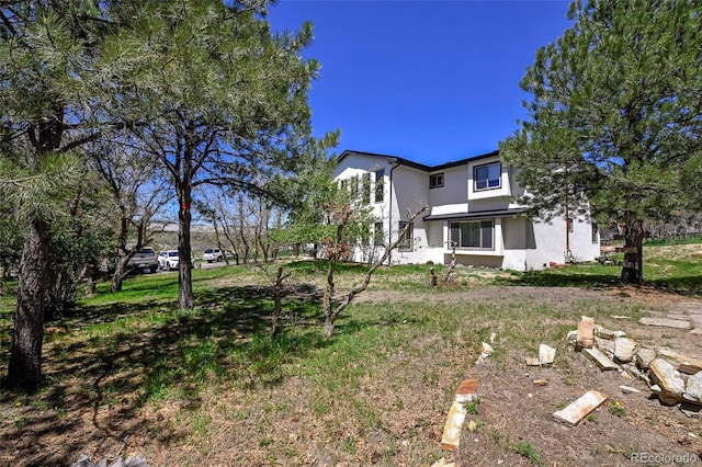1673 Woodmoor Dr, Monument, CO 80132 - view of front of property featuring stucco siding