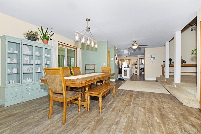 1673 Woodmoor Dr, Monument, CO 80132 - dining area featuring wood finished floors, ceiling fan, and baseboards