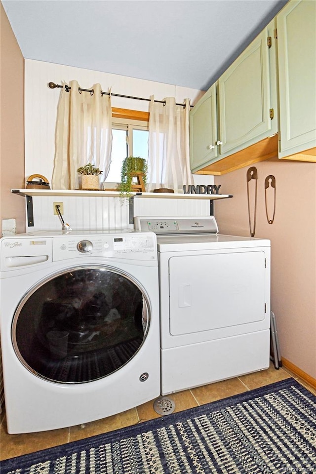 1673 Woodmoor Dr, Monument, CO 80132 - washroom featuring cabinet space, washing machine and clothes dryer, and light tile patterned floors