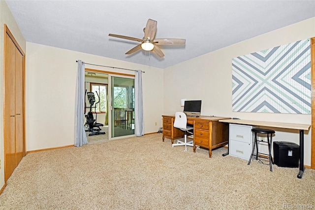 1673 Woodmoor Dr, Monument, CO 80132 - home office with light colored carpet, a ceiling fan, and baseboards