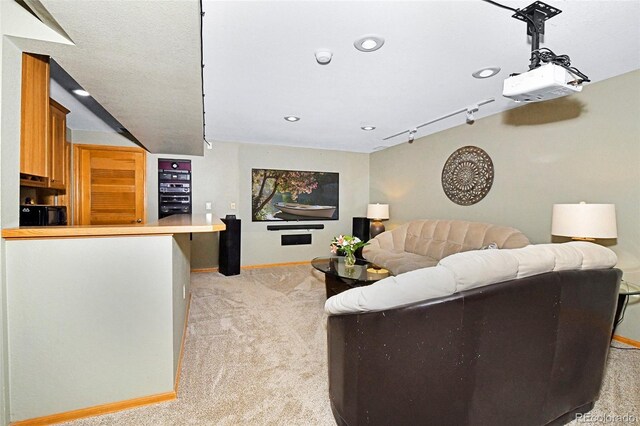 1673 Woodmoor Dr, Monument, CO 80132 - living area featuring light carpet, baseboards, and recessed lighting