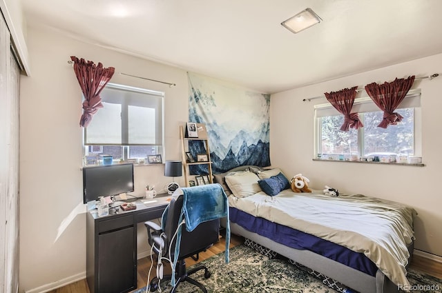 3205 Moorhead Ave, Boulder, CO 80305 - bedroom featuring multiple windows and wood finished floors