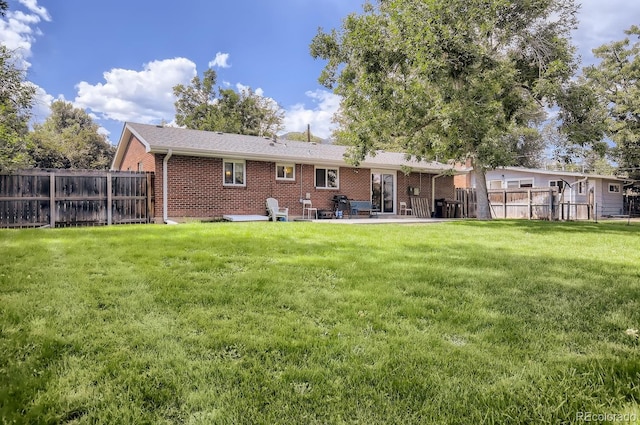 3205 Moorhead Ave, Boulder, CO 80305 - back of property with brick siding and a patio area