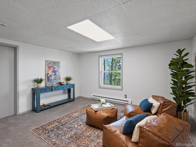 11650 Baca Rd, Conifer, CO 80433 - carpeted living room featuring a baseboard heating unit, a paneled ceiling, and baseboards