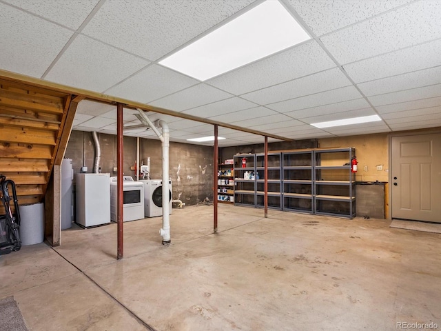 11650 Baca Rd, Conifer, CO 80433 - below grade area with washing machine and dryer and a paneled ceiling