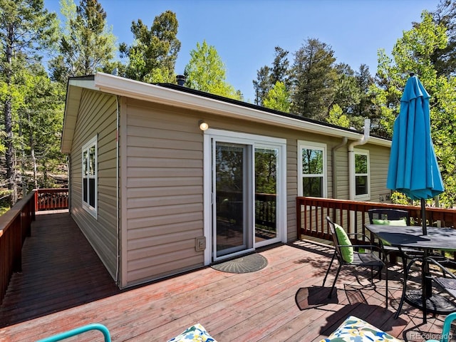 11650 Baca Rd, Conifer, CO 80433 - wooden deck with outdoor dining space