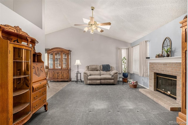 living area with carpet, a ceiling fan, a fireplace, vaulted ceiling, and a textured ceiling