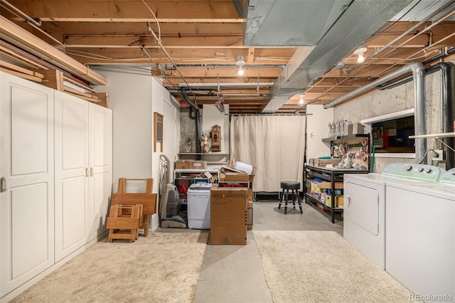 unfinished basement featuring washer and clothes dryer