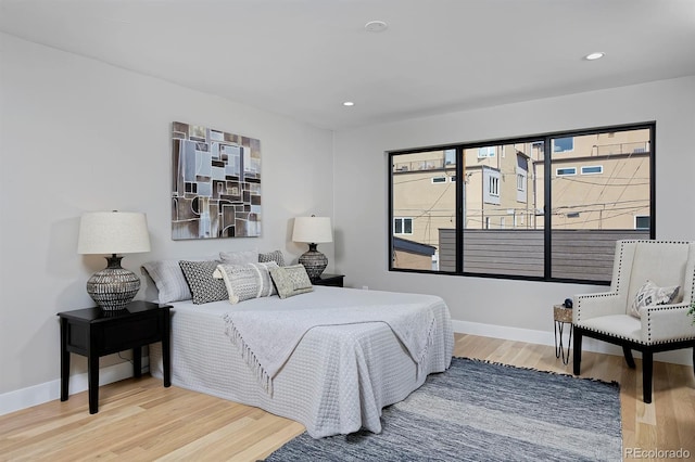 bedroom with hardwood / wood-style flooring