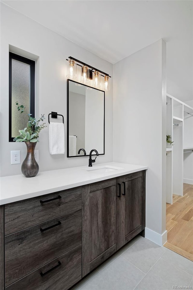 bathroom with hardwood / wood-style floors and vanity