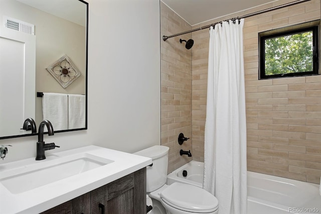 full bathroom with shower / tub combo, vanity, and toilet