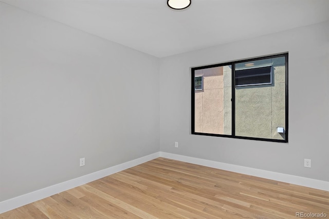 spare room featuring hardwood / wood-style floors