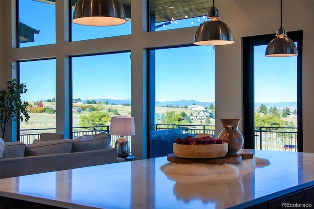 dining room with a mountain view and a wealth of natural light