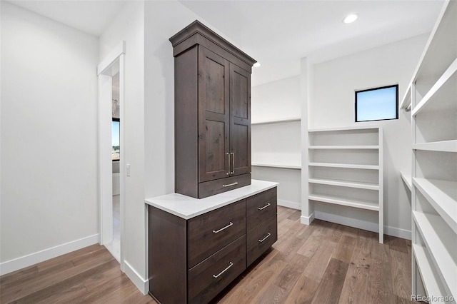 spacious closet featuring hardwood / wood-style floors