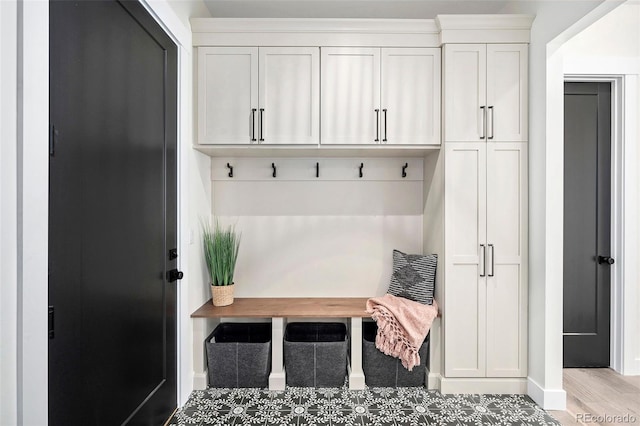 mudroom with light hardwood / wood-style flooring