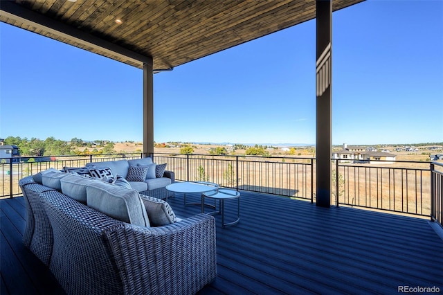 wooden terrace featuring an outdoor living space