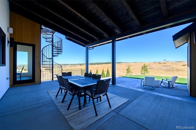 view of patio with a rural view