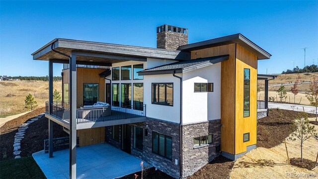 back of house featuring a patio