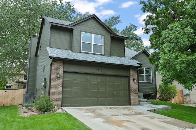 5370 S Union Way, Littleton, CO 80127 - view of front of house featuring a garage, brick siding, concrete driveway, a chimney, and central AC