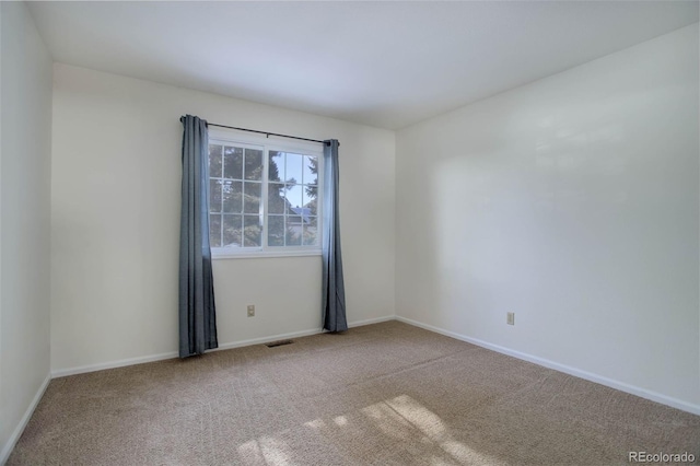 empty room with carpet flooring