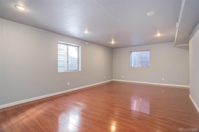 spare room with dark wood-type flooring