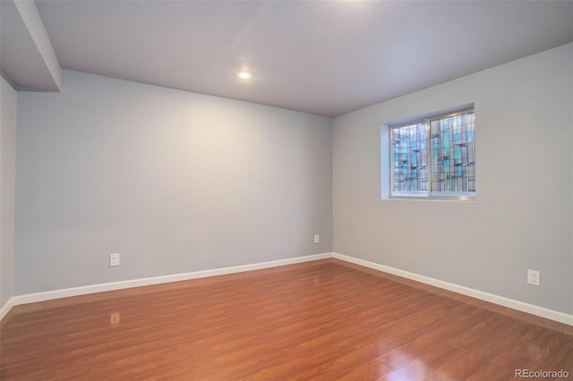 empty room featuring wood-type flooring