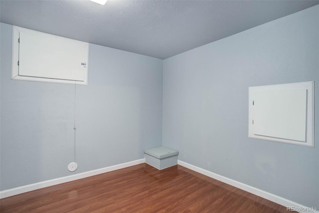 empty room featuring hardwood / wood-style floors and a textured ceiling