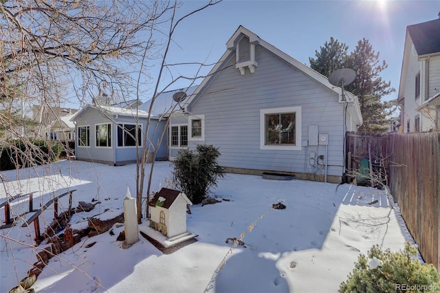 view of snow covered house