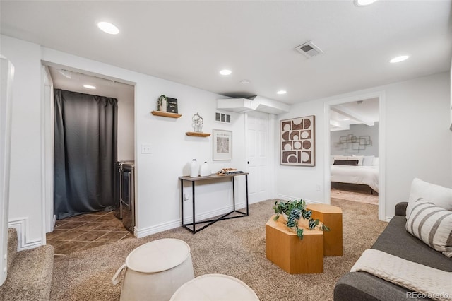 carpeted living room with baseboards, recessed lighting, and visible vents