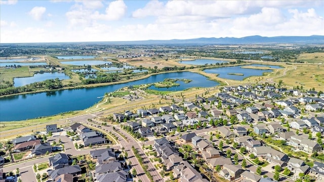 12862 Crane River Dr, Longmont, CO 80504 - aerial view of property and surrounding area with nearby suburban area and a water and mountain view