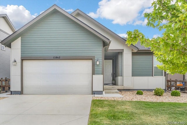 12862 Crane River Dr, Longmont, CO 80504 - ranch-style house with a garage, concrete driveway, and a front lawn