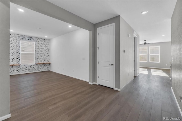 12862 Crane River Dr, Longmont, CO 80504 - spare room featuring wood finished floors, ceiling fan, and recessed lighting