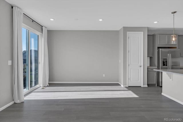 12862 Crane River Dr, Longmont, CO 80504 - kitchen featuring gray cabinetry, stainless steel fridge with ice dispenser, dark wood-style flooring, recessed lighting, and light countertops