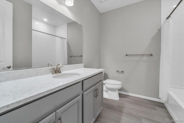 12862 Crane River Dr, Longmont, CO 80504 - full bathroom with vanity, wood finished floors, and shower / bath combo