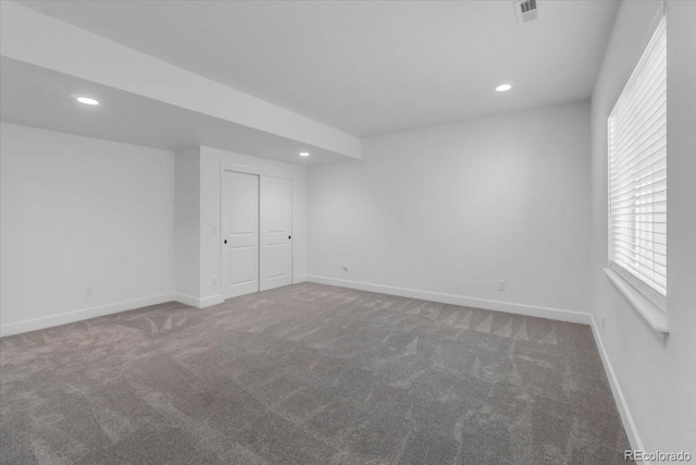 12862 Crane River Dr, Longmont, CO 80504 - unfurnished bedroom featuring carpet flooring, recessed lighting, multiple windows, and a closet