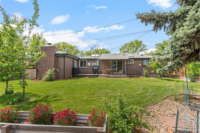 5455 E Iowa Ave, Denver, CO 80222 - rear view of property with a trampoline and brick siding