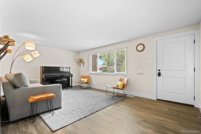 5455 E Iowa Ave, Denver, CO 80222 - living room with wood finished floors and baseboards