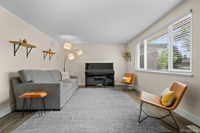 5455 E Iowa Ave, Denver, CO 80222 - living room featuring wood finished floors and baseboards